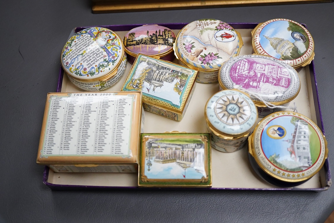 Eighteen Halcyon days enamel boxes and an enamel egg shaped box on stand